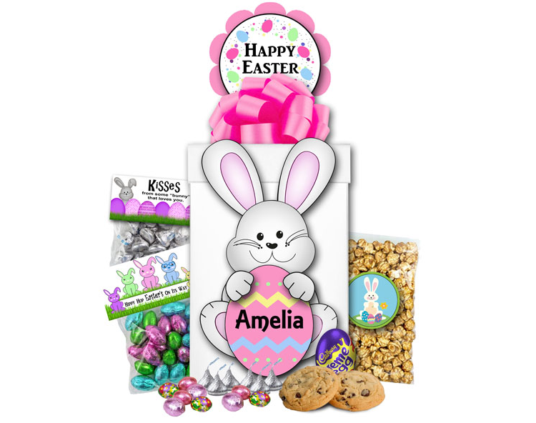 Image Pink Easter gift box filled with Easter candy, cookies and popcorn.